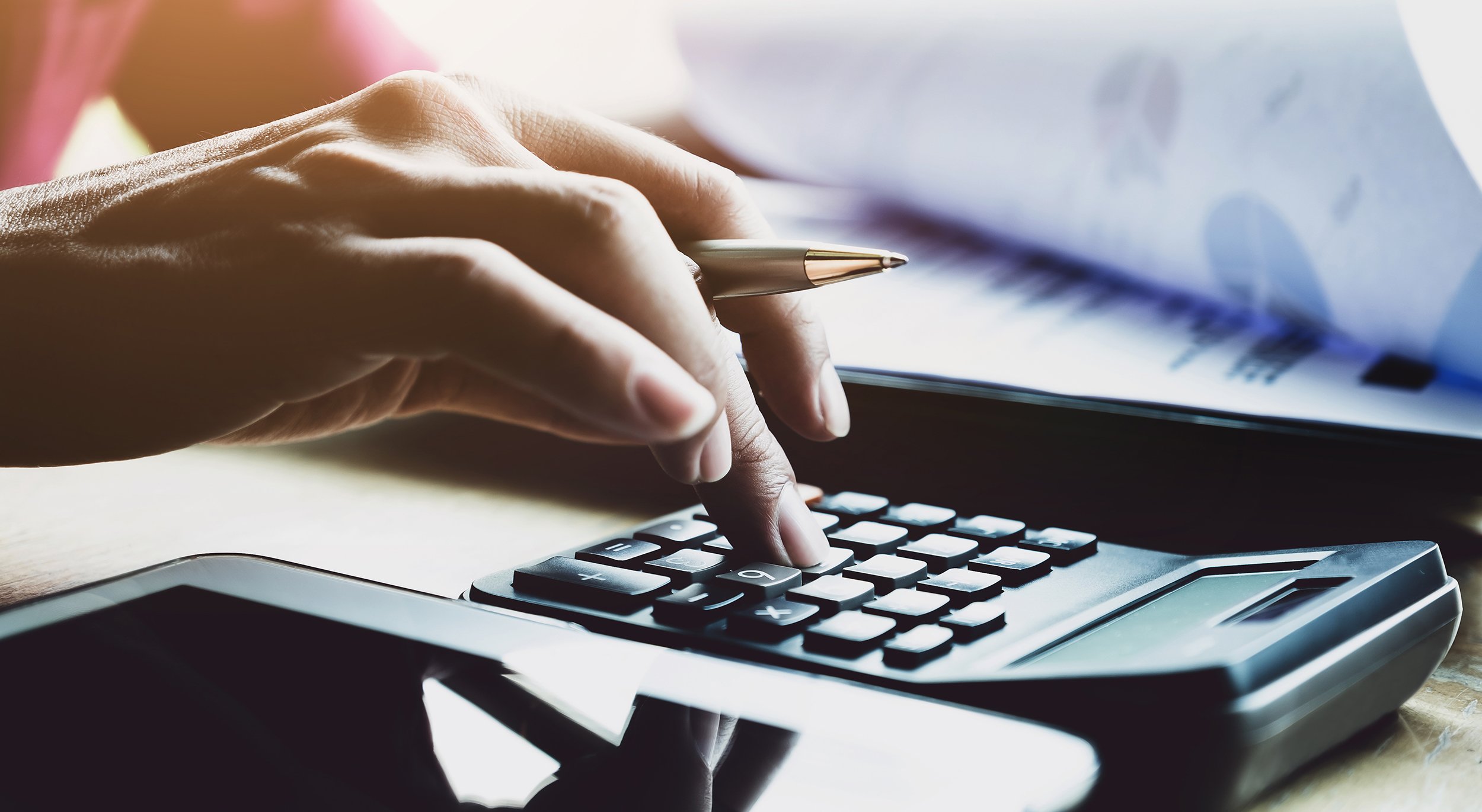 businessman working with calculator and digital tablet with fina virtual outsourced finance and accounting